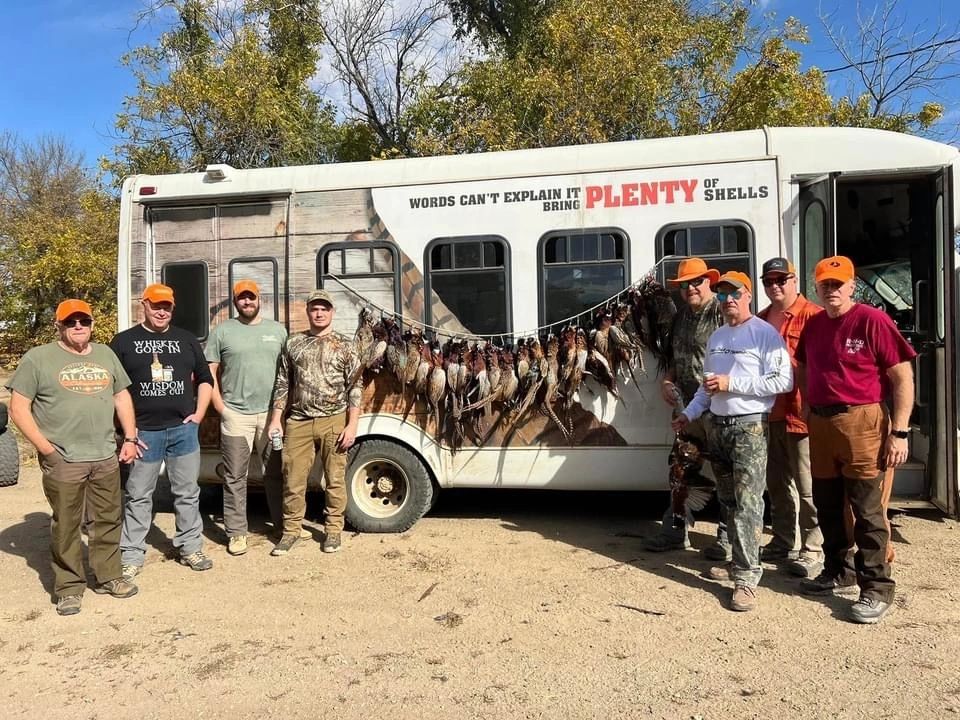 Hunters posing with the morning's pheasants at Prime Pheasant Hunting